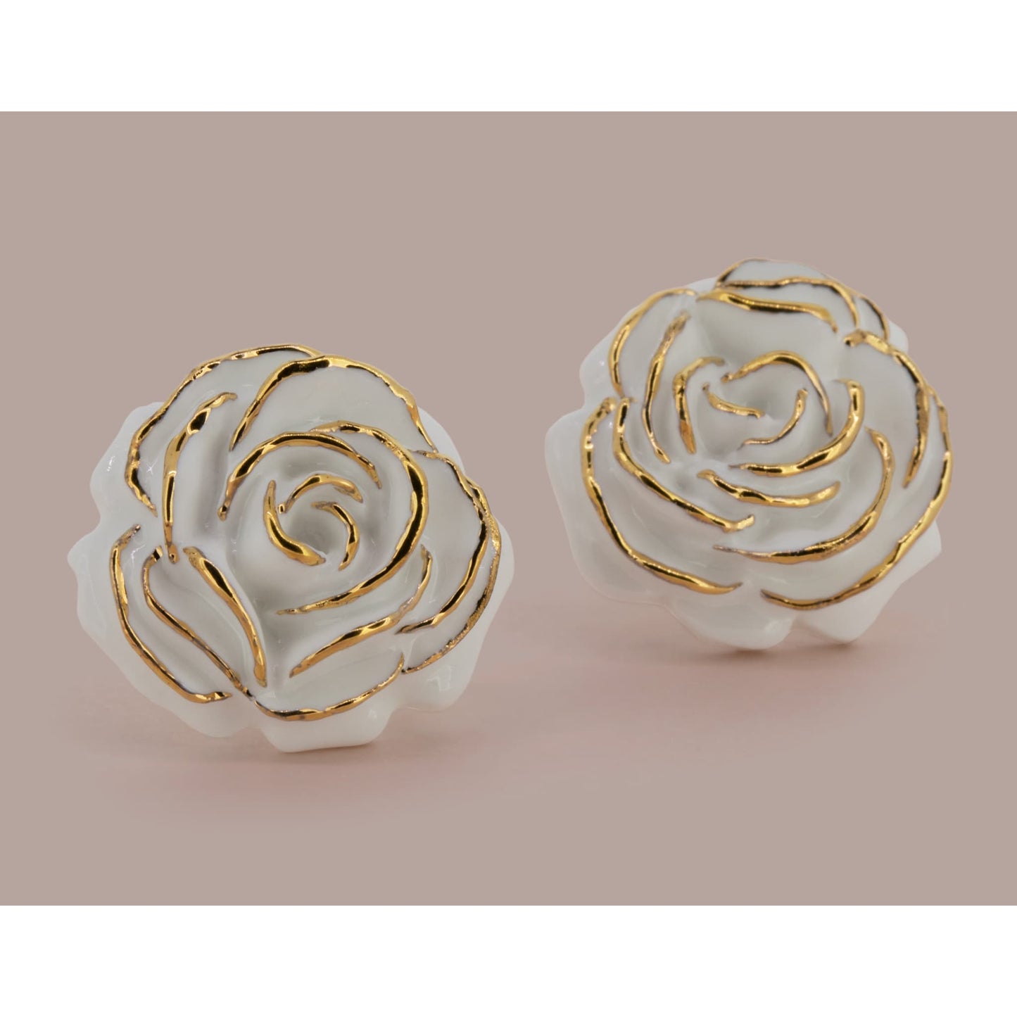 Big Rose Stud Earrings Made Of Porcelain In Pink Background