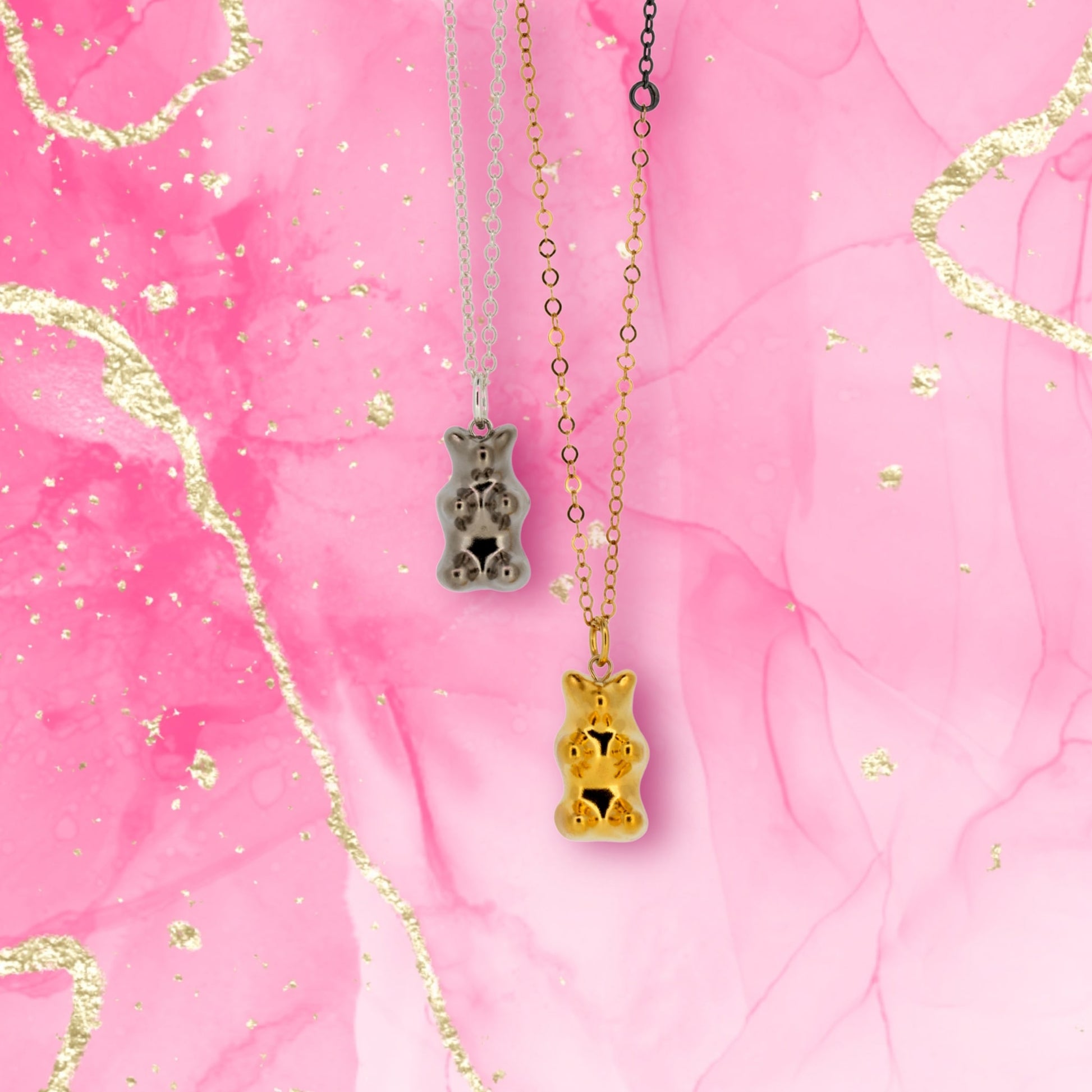 Silver Gummy Bear Necklace and Golden Jelly Jewelry  on pink background