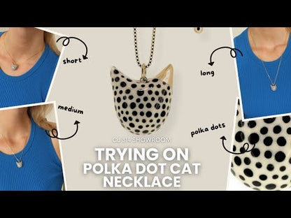 Trying on Cat Necklace with polka dots